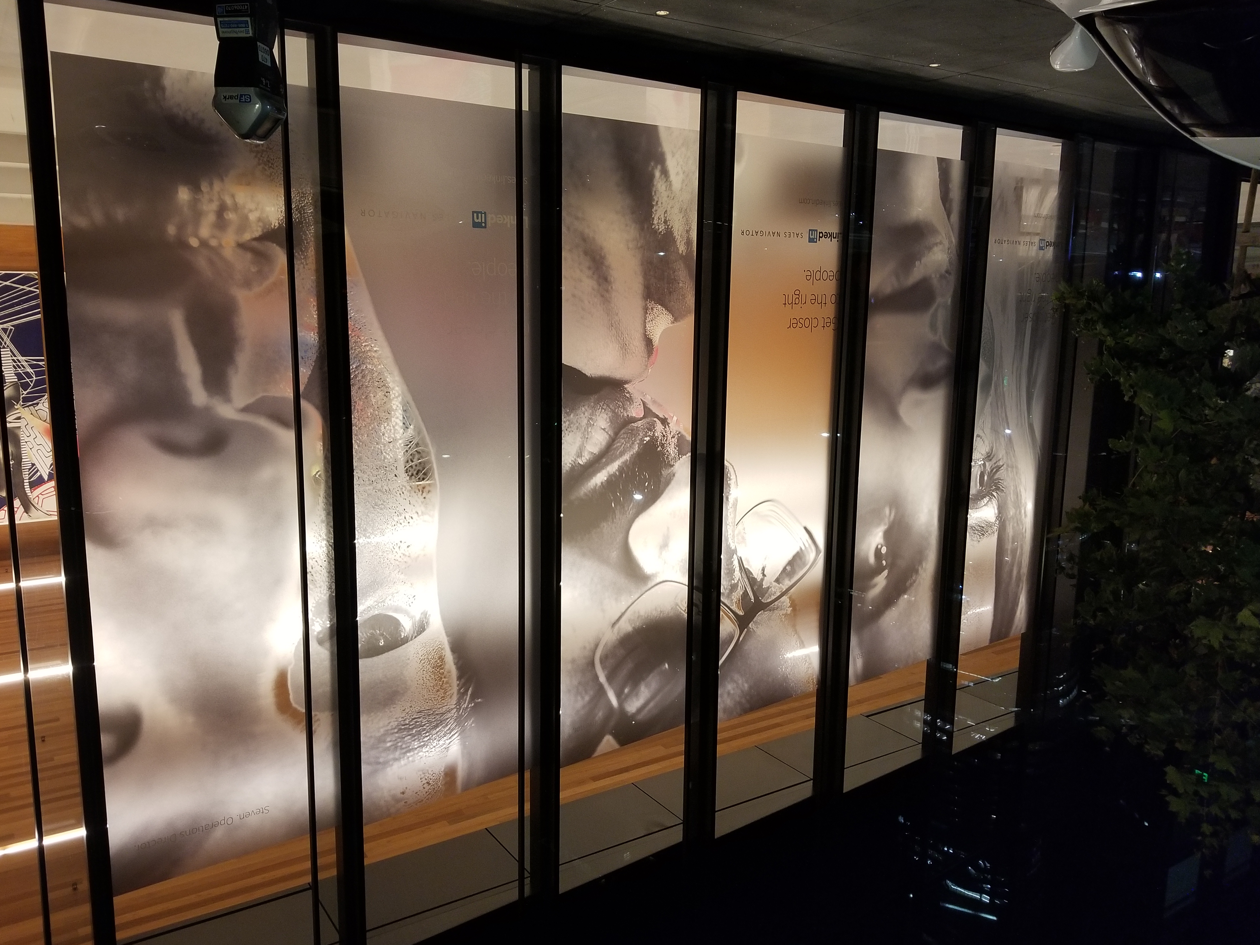 LinkedIn advertising graphics across storefront windows